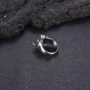 Close-up of vintage titanium steel ring featuring 3D tiger head relief and silver finish