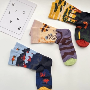 Detailed view of three artistic graffiti patterns on cotton crew socks with bold colors