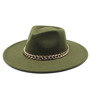 Close-up of dark green wool fedora hat featuring a chunky gold chain strap detail