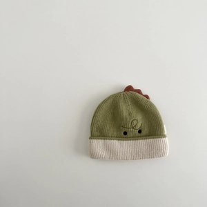 Close-up of baby winter knit hat featuring cute dinosaur embroidery and soft cuffed brim