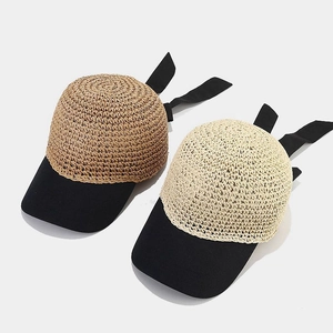 Japanese style crochet straw visor hat with a black brim and elegant ribbon bow tie