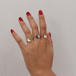 Three 18K gold plated adjustable Tai Chi rings on hand in green, blue and pink