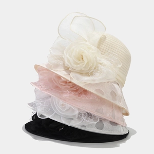 Detail of elegant organza sun hats with sheer floral accents and pearl centers in four colors