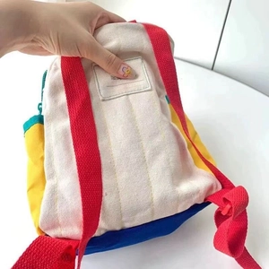 Colorful canvas toddler backpack with planet pattern and red adjustable straps