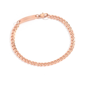 Detailed close-up of rose gold curb chain bracelet with engravable metal plate and lobster clasp