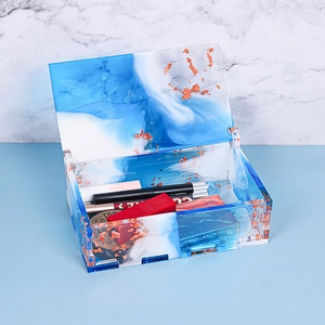 Detail of blue marble resin storage box with gold foil flakes and vanity organizers