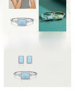 Macro shot of S925 sterling silver ring and earrings with blue opal and zircon stones
