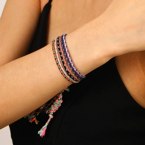 Bohemian handmade braided bracelet set with colorful threads and metallic bead accents