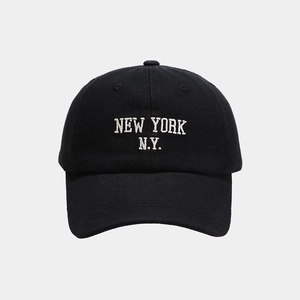 Close-up of premium black cotton baseball cap featuring white New York embroidery detail