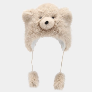 Detail view of plush polar bear hat showing soft faux fur and fluffy decorative pompoms