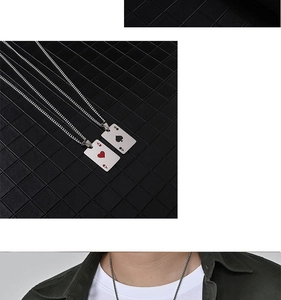 Detail of Ace of Hearts and Ace of Spades poker card pendants on silver chain necklaces