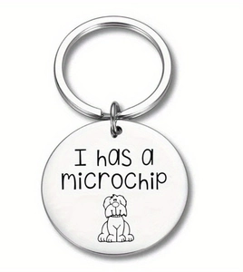 Close-up of stainless steel pet keychain with I Has a Microchip text and dog icon