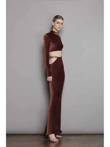 Detail of dark brown velvet dress with side cutout and elegant gold chain waist detail