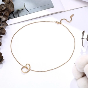 Detailed close-up of gold minimalist necklace with interlocking rings on a clean white background