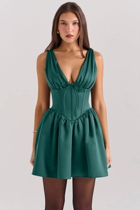 Detail of dark emerald green mini dress with deep V-neck and corset style waist bow