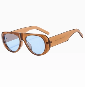 Detail view of tortoiseshell frame aviator sunglasses with gradient blue lenses and CE mark