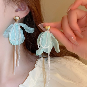 Sweet light blue tulle flower earrings with pearl tassels and golden heart studs on model