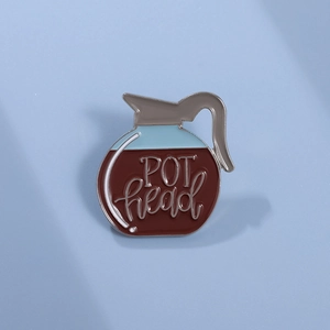 Minimalist enamel coffee pot lapel pin featuring POT head text and silver metal edges