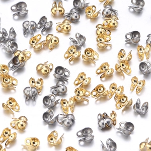 Detailed view of silver and gold stainless steel bead chain connectors for DIY jewelry