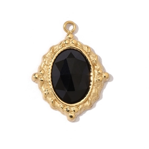 Close-up of gold-plated stainless steel pendant featuring a faceted black oval stone
