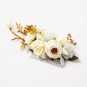 Elegant cream fabric rose bridal hair comb with green leaves on silver metal base