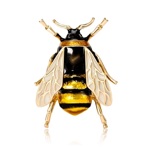 Exquisite honey bee brooch in gold alloy with black and yellow enamel on white background