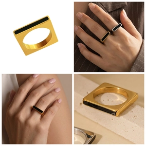 Detailed macro view of geometric square stainless steel ring with black enamel inlay