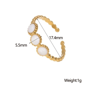 Detail view of wavy gold open ring with three white stones and size measurements
