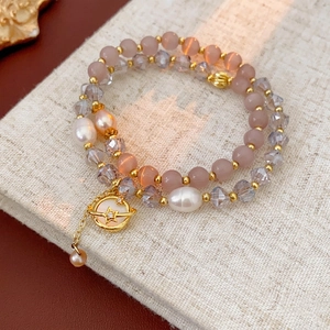 Bracelet élégant double couche en œil de chat et perles avec un pendentif planète doré