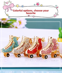 Detail view of rhinestone-encrusted roller skate keychains in four vibrant color options
