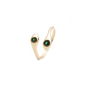 Detailed view of dual snake heads with green gemstone eyes on a gold plated ring