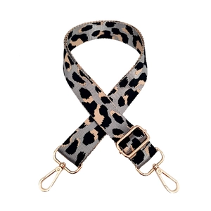 Detail of adjustable leopard print wide shoulder strap with gold metal lobster clasps
