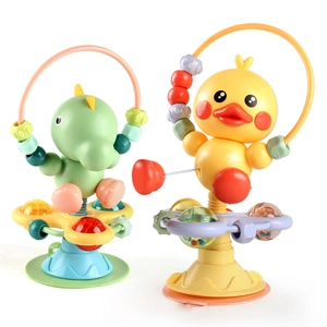 Suction cup spinning rattle toy featuring dinosaur and duck designs for high chair play