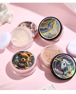 Detail view of four radiant loose powders with holographic fairy and unicorn lids