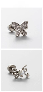 Detailed close-up of bow earrings with shimmering zircons and opal-like heart stones