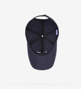 Interior detail of navy cotton baseball cap showing seams, sweatband and inner lining