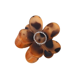 Leopard print flower hair claw clip with amber tortoise shell pattern and rhinestones