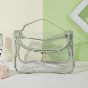 Portable transparent makeup bag with light green trim and golden double zippers