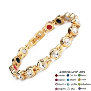 Detail of gold titanium steel magnetic bracelet with colorful stone inserts and zircon