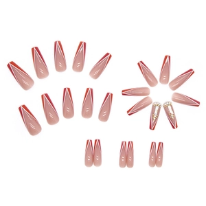 Long ballet press-on nails featuring a red and nude ombre design with rhinestone accents