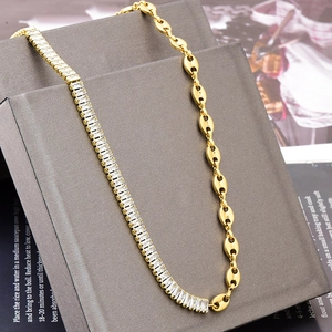 Gold plated stainless steel necklace featuring rectangular cubic zirconia and pig nose links
