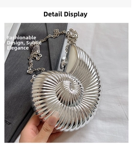 Detailed macro view of silver shell-shaped evening bag with spiral metallic texture