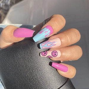 Mid-length coffin press-on nails with purple flame designs and cute smiley face patterns