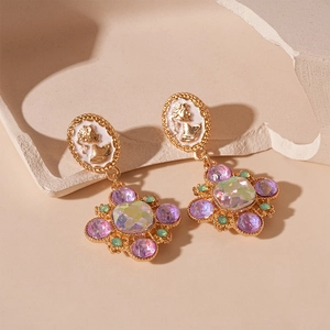 Vintage gold portrait relief earrings with purple gemstones and French palace style design