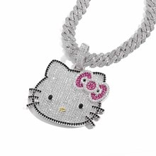 Macro detail of iced-out Hello Kitty cactus pendant with colorful pavé micro-zirconia stones