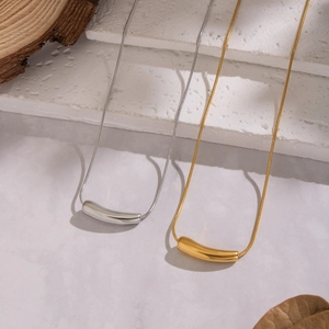 Minimalist geometric curved tube pendant necklace in gold and silver steel finish
