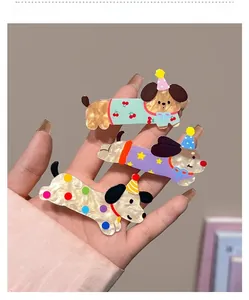 Detailed view of three cartoon dachshund hair clips made of marbled acetate material