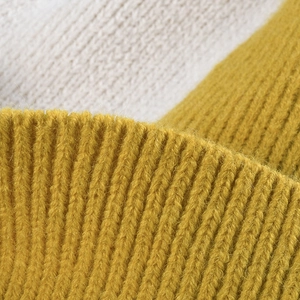 Women's autumn knit hat featuring a yellow and beige bicolor ribbed pattern