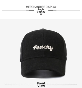 Detailed embroidery of white Peachy text on a black cotton twill baseball cap
