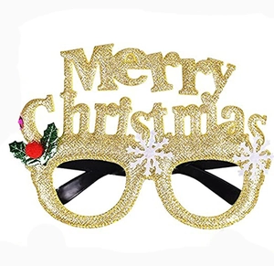 Detail of gold glitter Christmas glasses frame with Merry Christmas text and holly leaf decor